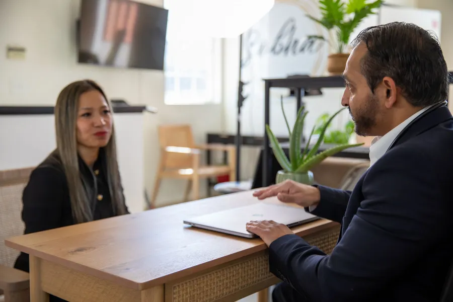Dr. Bhavesh Patel in consultation with a patient across a desk