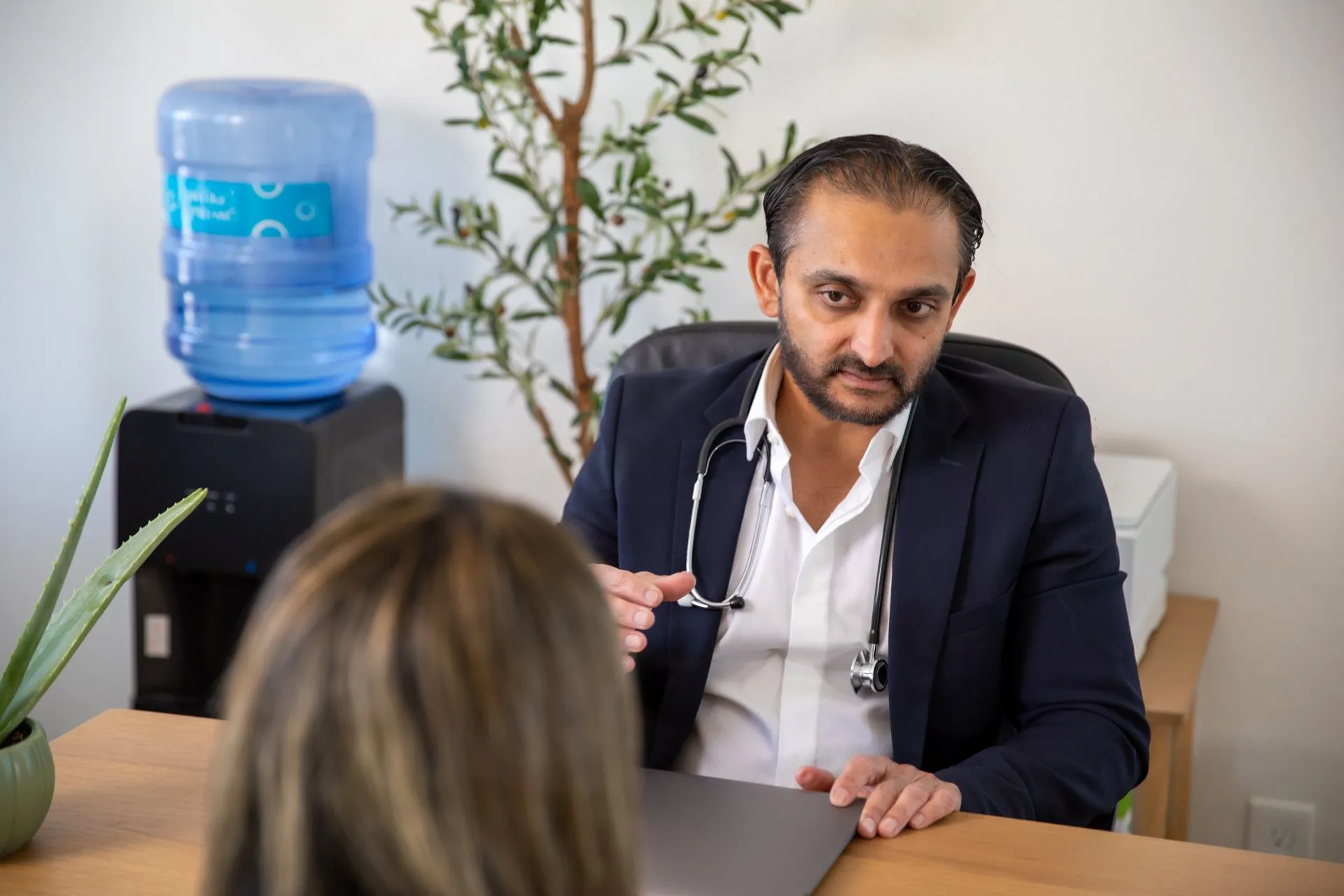Dr. Bhavesh Patel in consultation at the Rx2BFIT office